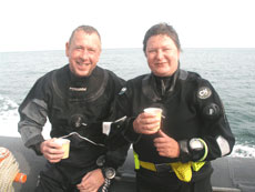 John & Paula enjoying a hot drink after a great dive!